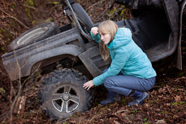 Woman shocked by an estremal ride on UTV. Checks the status of a buggy